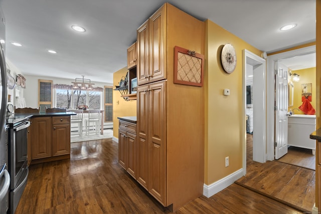 73 Lake Shore Dr, East Haddam, CT 06415 - kitchen with baseboards, stainless steel range with electric stovetop, dark wood finished floors, dark countertops, and recessed lighting