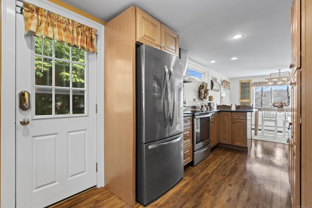 73 Lake Shore Dr, East Haddam, CT 06415 - kitchen with appliances with stainless steel finishes, a peninsula, dark wood finished floors, dark countertops, and recessed lighting
