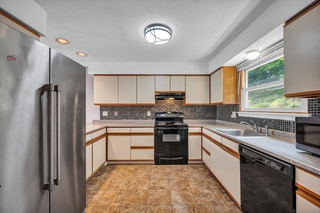 129 Knowles Ave Unit 129, Middletown, CT 06457 - kitchen with black appliances, a sink, under cabinet range hood, backsplash, and light countertops