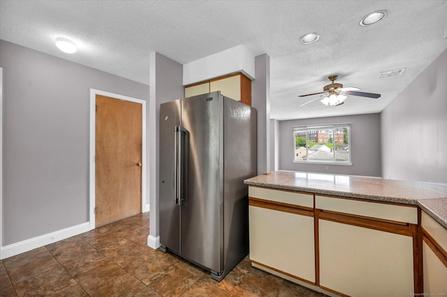 129 Knowles Ave Unit 129, Middletown, CT 06457 - kitchen featuring freestanding refrigerator, a textured ceiling, ceiling fan, baseboards, and light countertops