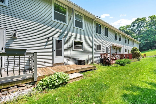 129 Knowles Ave Unit 129, Middletown, CT 06457 - back of house with a wooden deck, a lawn, and central air condition unit