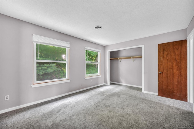 129 Knowles Ave Unit 129, Middletown, CT 06457 - unfurnished bedroom featuring carpet flooring, baseboards, a closet, and a textured ceiling