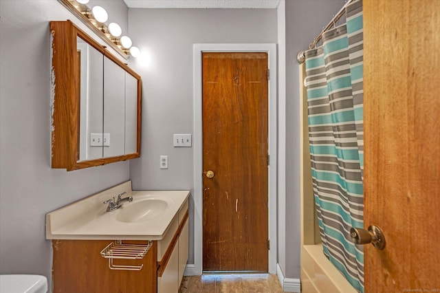 129 Knowles Ave Unit 129, Middletown, CT 06457 - bathroom featuring vanity, toilet, tile patterned flooring, and shower / tub combo with curtain