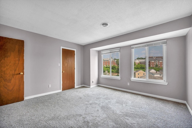 129 Knowles Ave Unit 129, Middletown, CT 06457 - unfurnished bedroom featuring carpet, baseboards, and a textured ceiling
