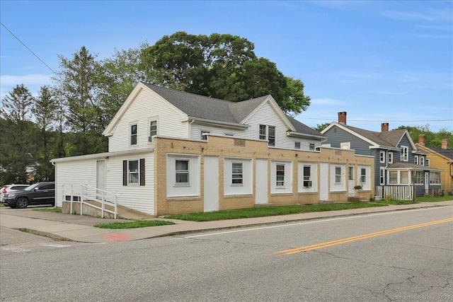124 Main St, Sprague, CT 06330 - view of property featuring brick siding