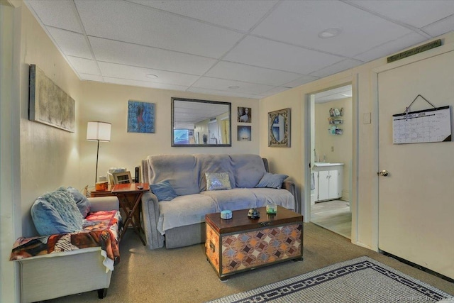 124 Main St, Sprague, CT 06330 - living room featuring a drop ceiling and carpet floors