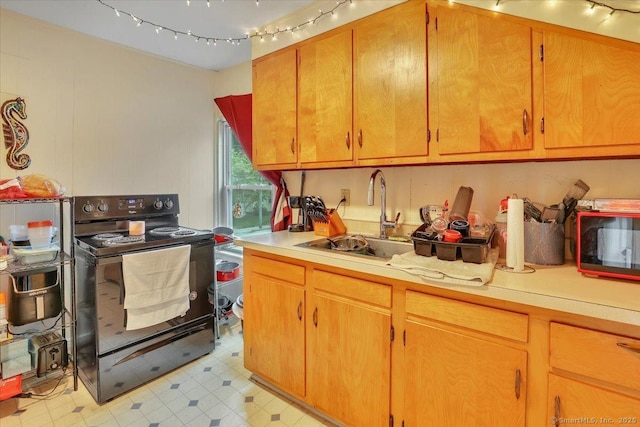 124 Main St, Sprague, CT 06330 - kitchen featuring black / electric stove, light countertops, and light floors