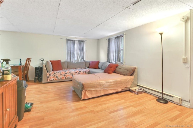 124 Main St, Sprague, CT 06330 - living room featuring a baseboard heating unit and wood finished floors