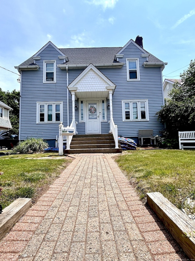 475 Lighthouse Rd, New Haven, CT 06512 - view of front of home featuring a chimney, a front lawn, and entry steps