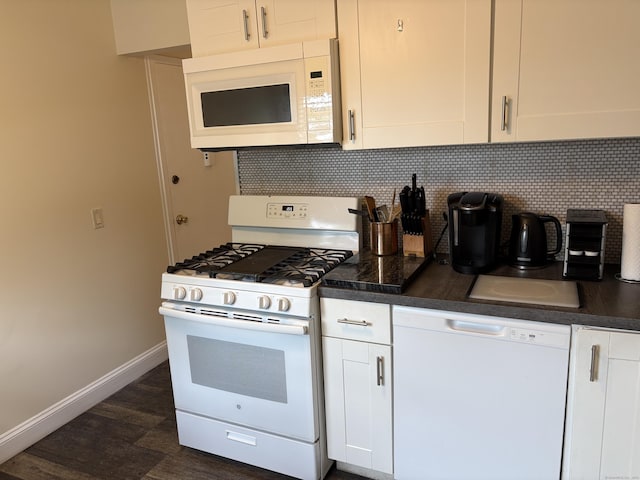 80 County St Apt 7K, Norwalk, CT 06851 - kitchen with white appliances, dark countertops, decorative backsplash, and baseboards