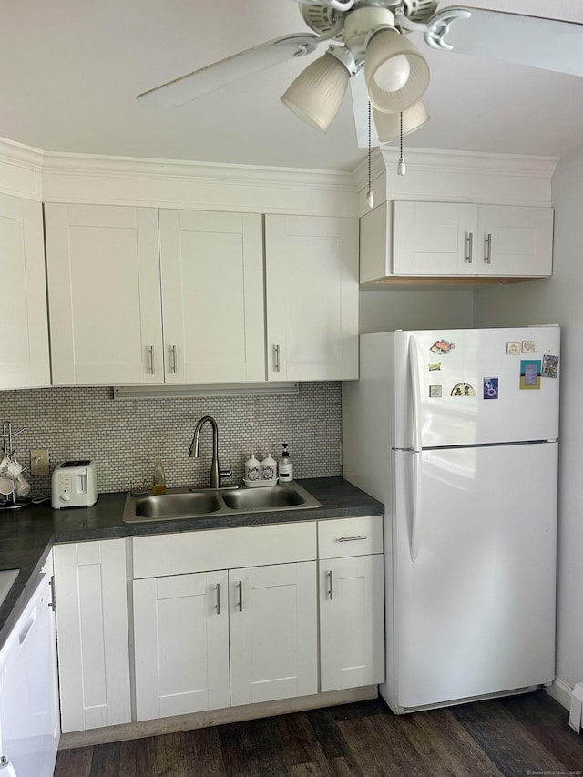 80 County St Apt 7K, Norwalk, CT 06851 - kitchen featuring freestanding refrigerator, a sink, dark countertops, dark wood-style flooring, and crown molding
