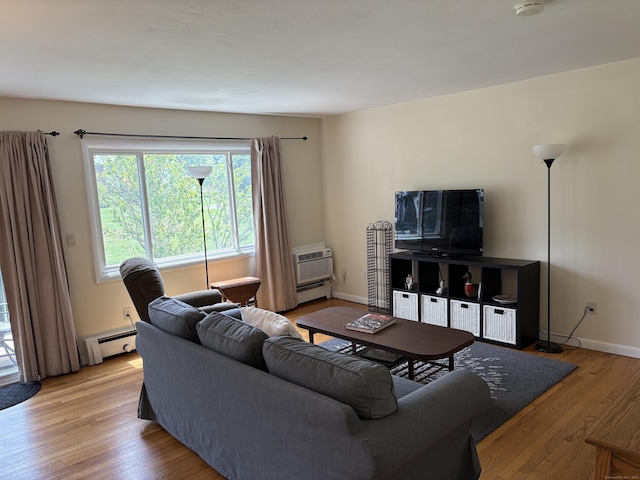 80 County St Apt 7K, Norwalk, CT 06851 - living room with a baseboard heating unit, light wood-type flooring, a wall mounted AC, and baseboards