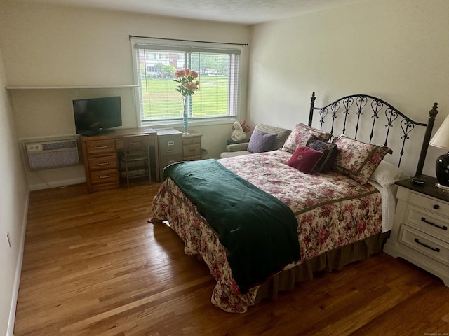 80 County St Apt 7K, Norwalk, CT 06851 - bedroom featuring wood finished floors and a wall mounted AC