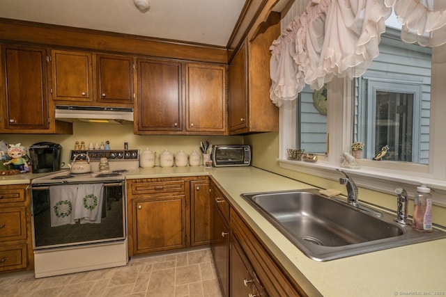 30 Dwight Rd, Middlefield, CT 06455 - kitchen featuring electric stove, a sink, under cabinet range hood, light countertops, and brown cabinetry