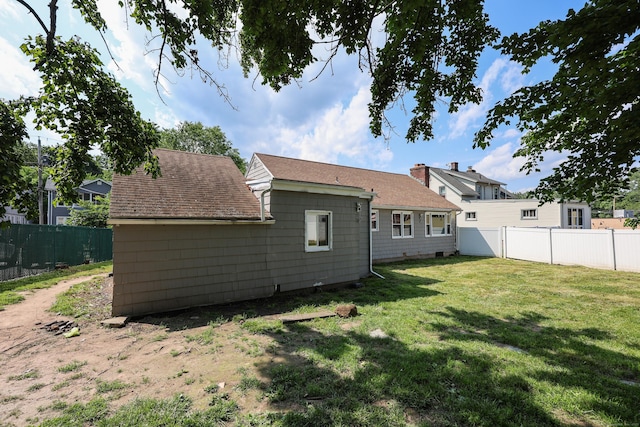 103 Anthony St, New Haven, CT 06515 - back of house with a fenced backyard and roof with shingles