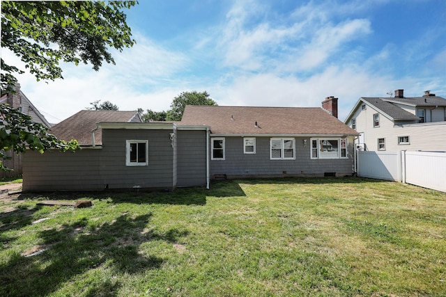 103 Anthony St, New Haven, CT 06515 - back of property featuring a chimney and roof with shingles