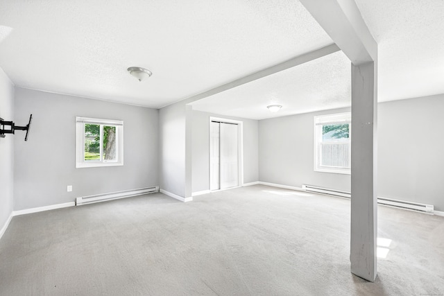 103 Anthony St, New Haven, CT 06515 - carpeted spare room featuring a baseboard radiator, a textured ceiling, and plenty of natural light