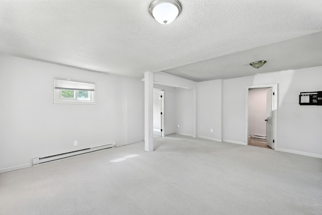 103 Anthony St, New Haven, CT 06515 - below grade area with baseboard heating, a textured ceiling, and carpet