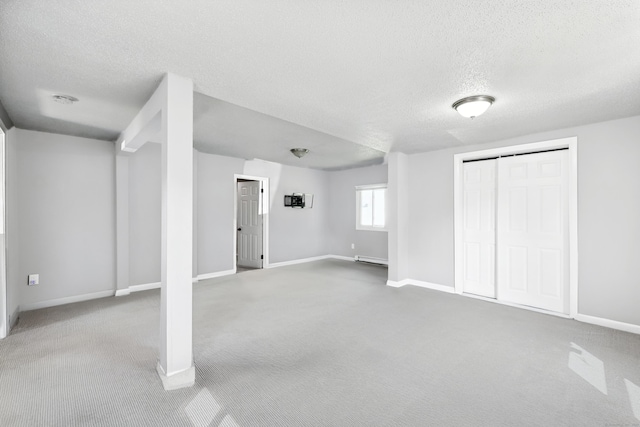 103 Anthony St, New Haven, CT 06515 - below grade area with a textured ceiling, carpet, and baseboard heating