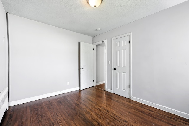 103 Anthony St, New Haven, CT 06515 - unfurnished bedroom with wood finished floors, a textured ceiling, and a closet