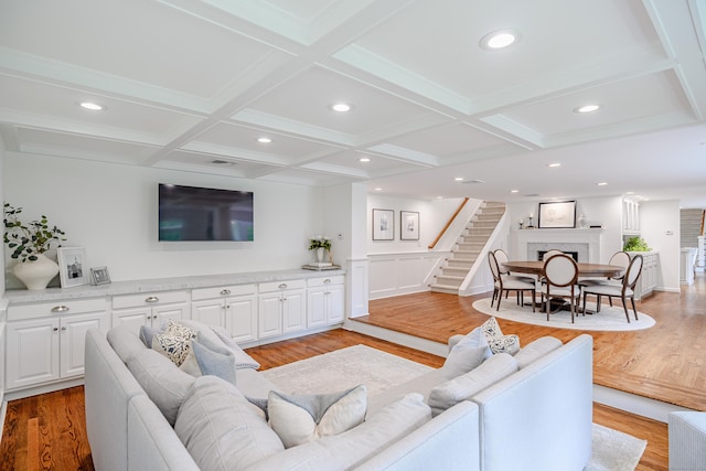 20 Copper Beech Ln, Ridgefield, CT 06877 - living room with coffered ceiling, light wood-type flooring, beam ceiling, stairs, and recessed lighting