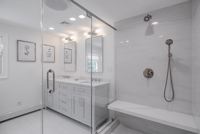 20 Copper Beech Ln, Ridgefield, CT 06877 - full bath featuring double vanity, a tile shower, marble look tile flooring, and recessed lighting