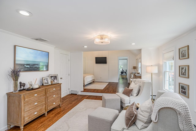 20 Copper Beech Ln, Ridgefield, CT 06877 - living room with wood finished floors, crown molding, baseboard heating, recessed lighting, and a baseboard radiator