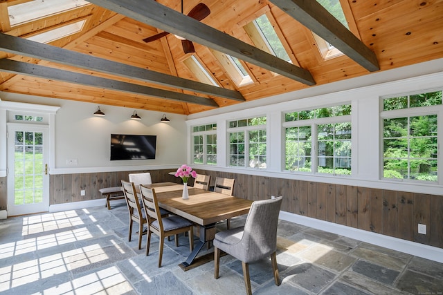 20 Copper Beech Ln, Ridgefield, CT 06877 - dining area featuring a skylight, beamed ceiling, a wainscoted wall, high vaulted ceiling, and stone tile floors