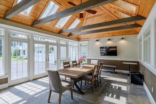 20 Copper Beech Ln, Ridgefield, CT 06877 - dining area featuring a skylight, french doors, beam ceiling, wainscoting, and high vaulted ceiling