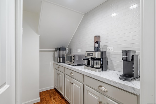 20 Copper Beech Ln, Ridgefield, CT 06877 - bar with vaulted ceiling, dark wood-style flooring, and baseboards