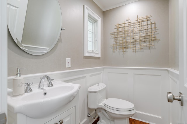20 Copper Beech Ln, Ridgefield, CT 06877 - bathroom with toilet, wainscoting, vanity, a decorative wall, and crown molding