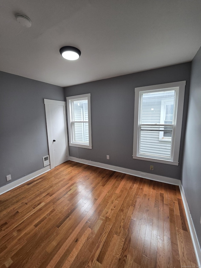 167 W St, New Haven, CT 06519 - empty room with dark wood finished floors and baseboards
