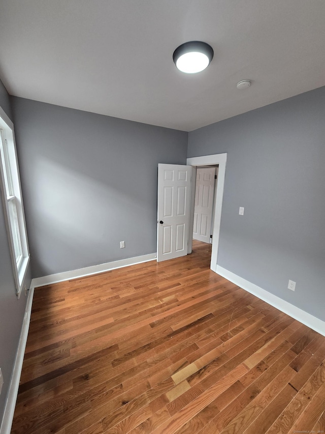 167 W St, New Haven, CT 06519 - unfurnished room featuring wood finished floors, a smoke detector, and baseboards