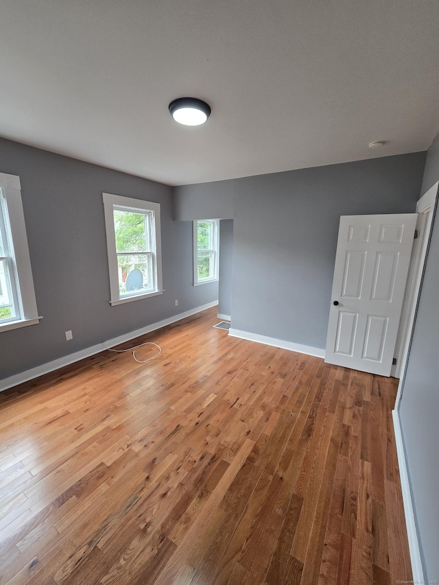 167 W St, New Haven, CT 06519 - empty room featuring light wood-style floors and baseboards