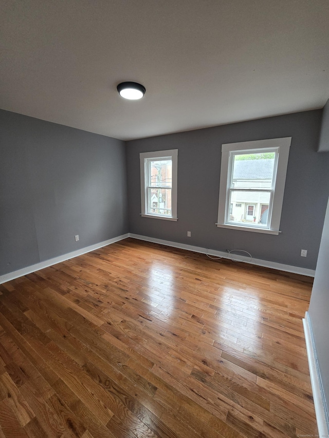 167 W St, New Haven, CT 06519 - unfurnished room with plenty of natural light, wood finished floors, and baseboards