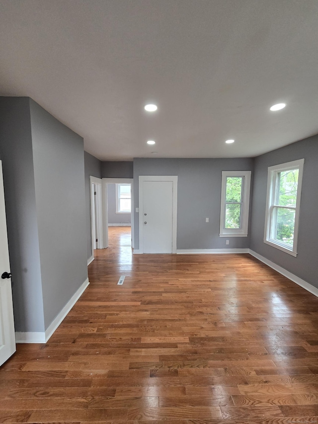 167 W St, New Haven, CT 06519 - unfurnished room featuring healthy amount of natural light, baseboards, wood finished floors, and recessed lighting