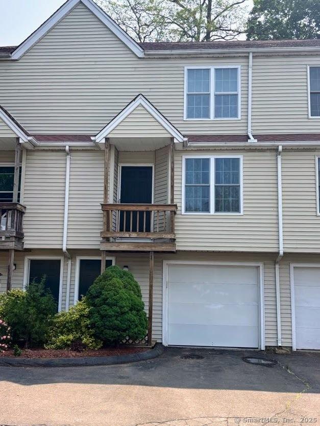 41 High St Apt 2, East Haven, CT 06512 - multi unit property with an attached garage, driveway, and a balcony