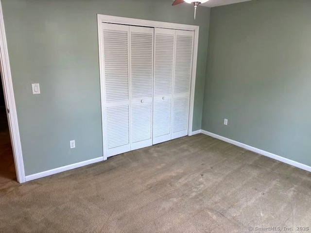 41 High St Apt 2, East Haven, CT 06512 - unfurnished bedroom featuring carpet, a closet, and baseboards