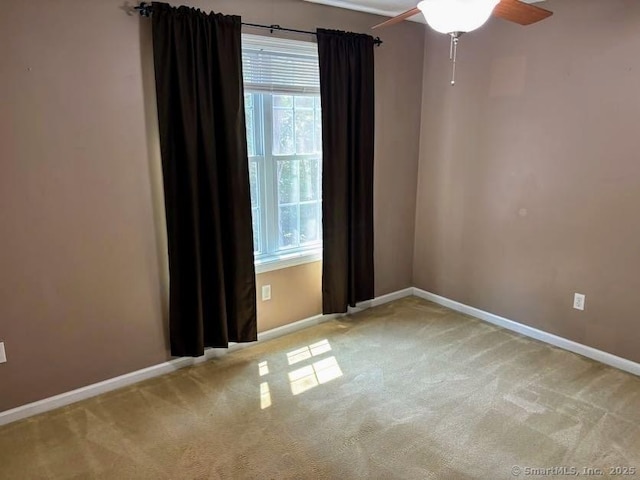 41 High St Apt 2, East Haven, CT 06512 - spare room featuring carpet, baseboards, and a ceiling fan