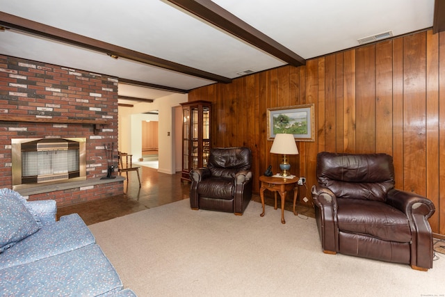 190 Allerton Farms Rd, Middlebury, CT 06762 - living room with beamed ceiling, carpet flooring, wood walls, and a brick fireplace