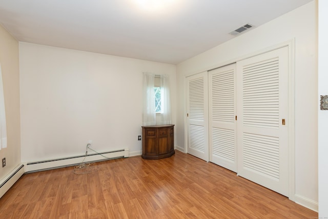 190 Allerton Farms Rd, Middlebury, CT 06762 - unfurnished bedroom featuring light wood-style flooring, a closet, a baseboard heating unit, and baseboards