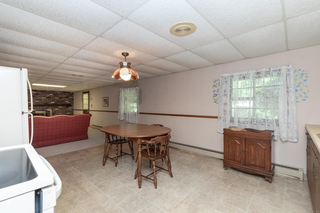 190 Allerton Farms Rd, Middlebury, CT 06762 - dining room with a baseboard heating unit, a paneled ceiling, a fireplace, and light floors