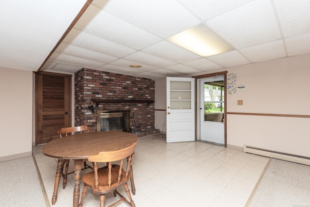 190 Allerton Farms Rd, Middlebury, CT 06762 - dining space featuring a baseboard radiator, a paneled ceiling, a brick fireplace, and baseboards