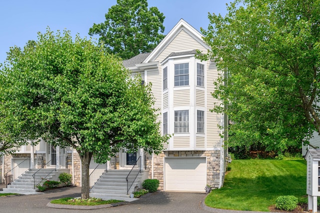 2006 Hancock Dr Unit 2006, Danbury, CT 06811 - multi unit property with stone siding, asphalt driveway, a garage, a front lawn, and stairway