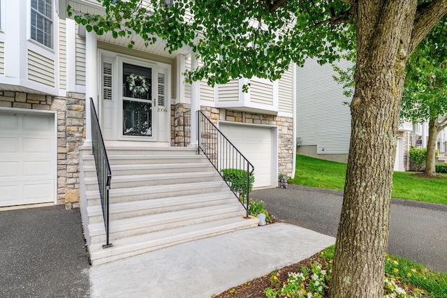 2006 Hancock Dr Unit 2006, Danbury, CT 06811 - entrance to property with stone siding, an attached garage, and asphalt driveway