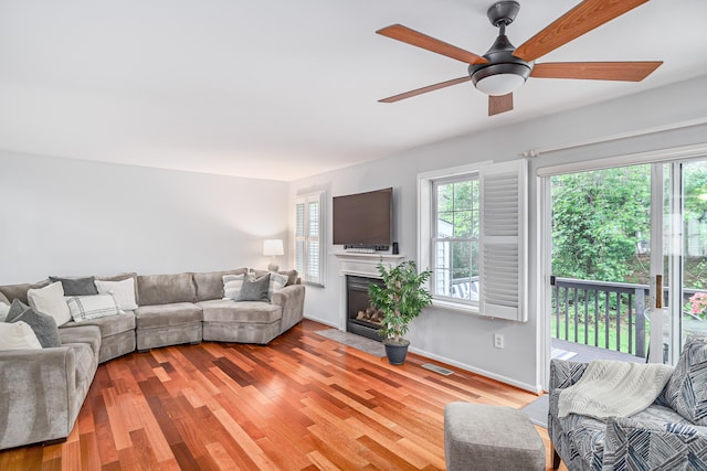 2006 Hancock Dr Unit 2006, Danbury, CT 06811 - living room with a ceiling fan, wood finished floors, and a fireplace with flush hearth