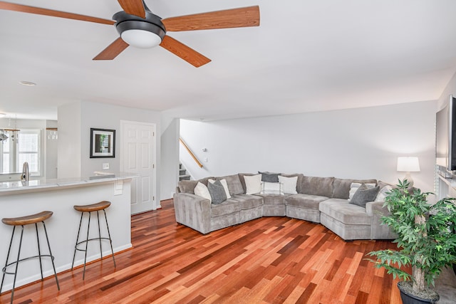 2006 Hancock Dr Unit 2006, Danbury, CT 06811 - living area with stairway, light wood finished floors, and ceiling fan