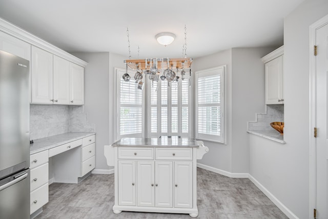 2006 Hancock Dr Unit 2006, Danbury, CT 06811 - walk in closet featuring built in study area, a chandelier, and light wood-style floors
