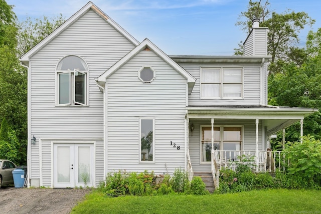 128 Santa Maria Dr, Torrington, CT 06790 - view of front facade featuring a porch and a chimney
