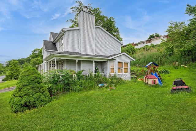 128 Santa Maria Dr, Torrington, CT 06790 - view of property exterior featuring a chimney, a playground, a yard, and a shingled roof
